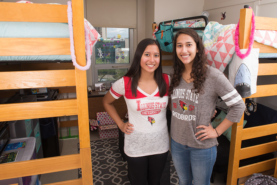 Sisters, Karen and Elizabeth Skylakos, pose in their dorm room